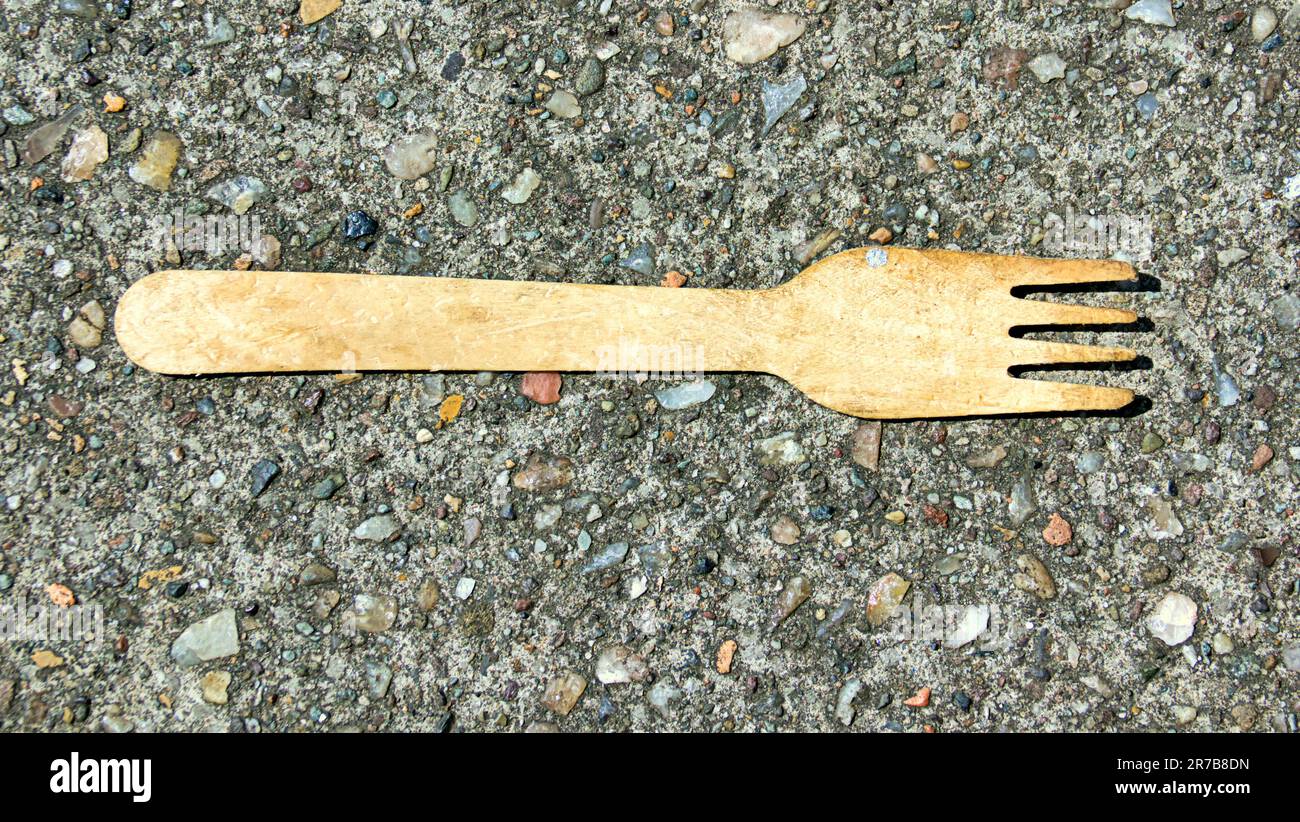 discarded fork on ground found art Stock Photo