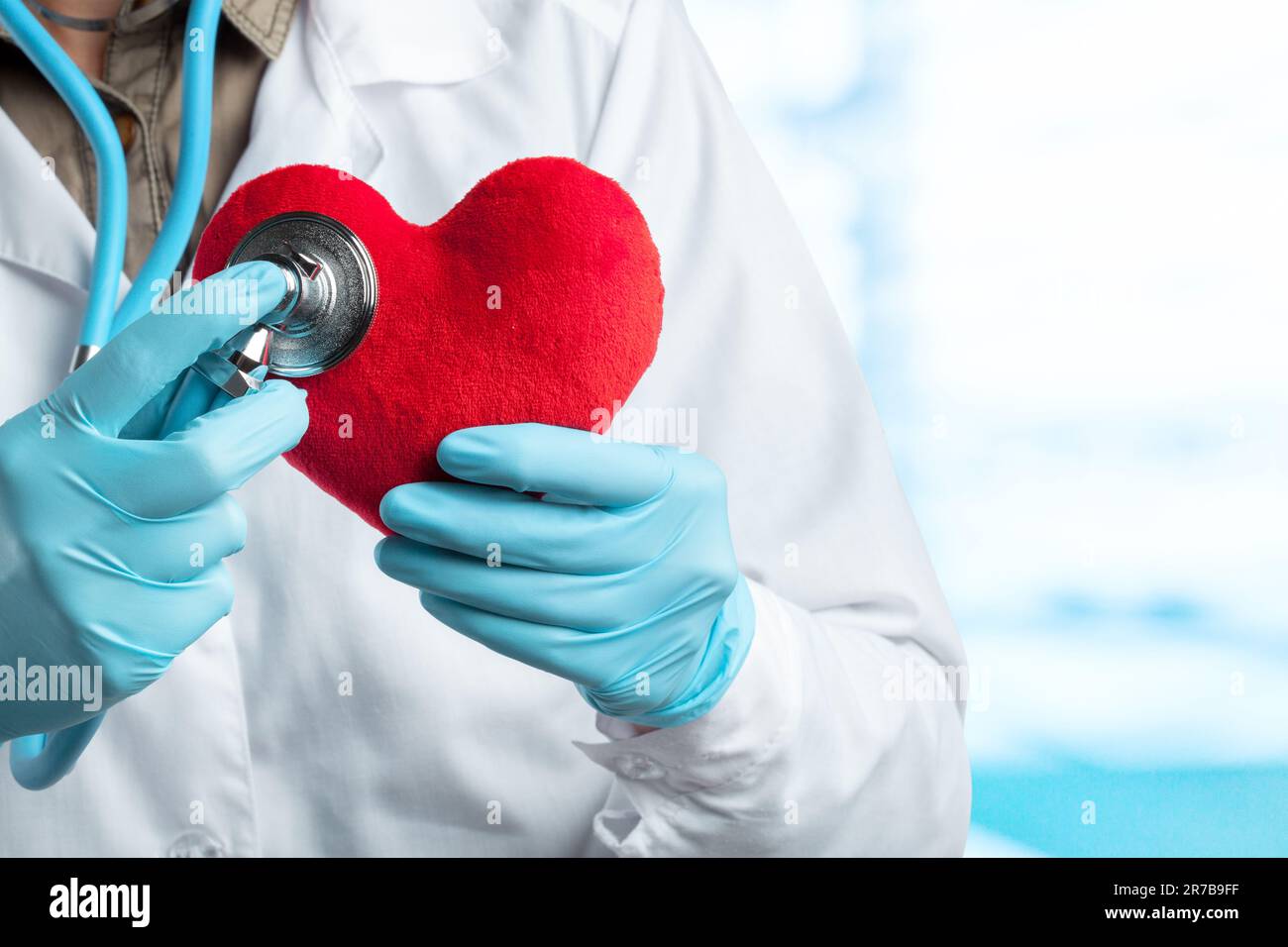 female doctor with stethoscope holding heart Stock Photo - Alamy