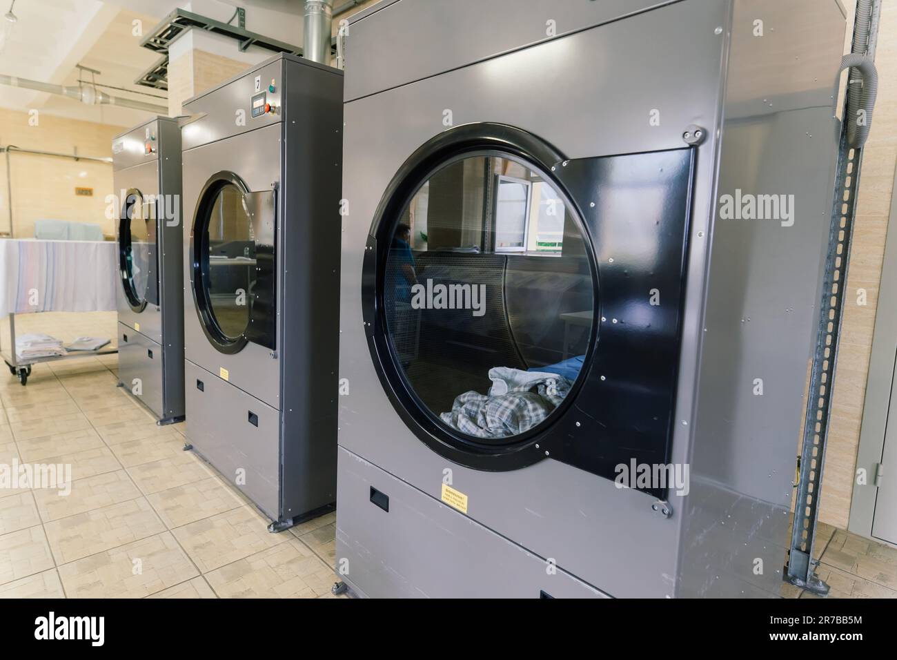 Line of laundry machine, washing machines. Automate equipment Stock ...
