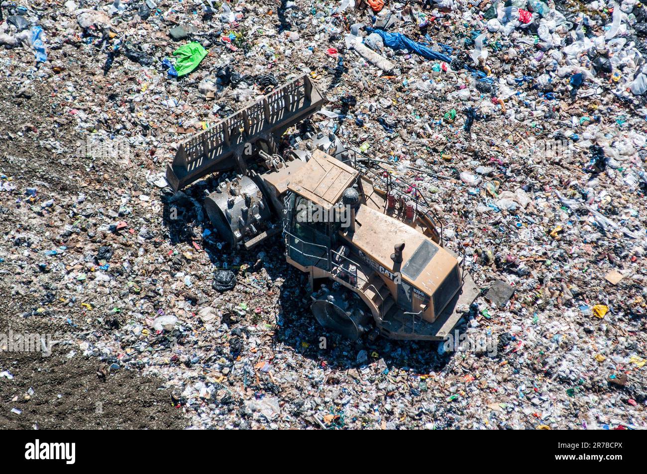 Aerial of a tractor working in landfill area Stock Photo Alamy