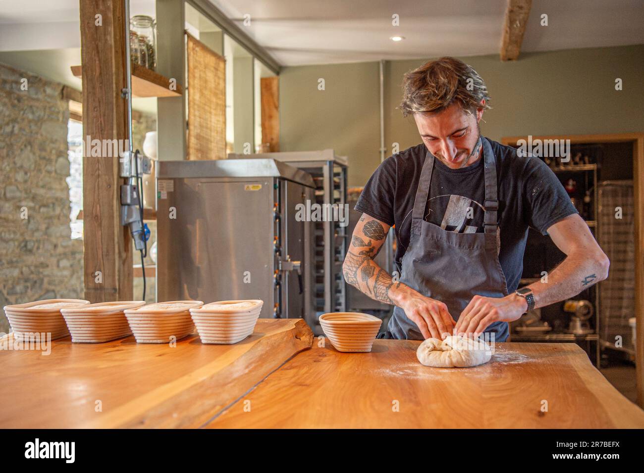 baker and pastry chef Zak Poulot in the new bakery Stock Photo