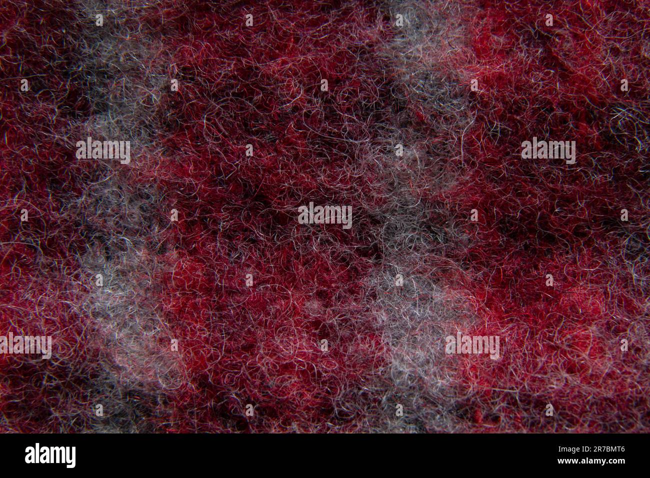 red woolen fabric closeup as background Stock Photo