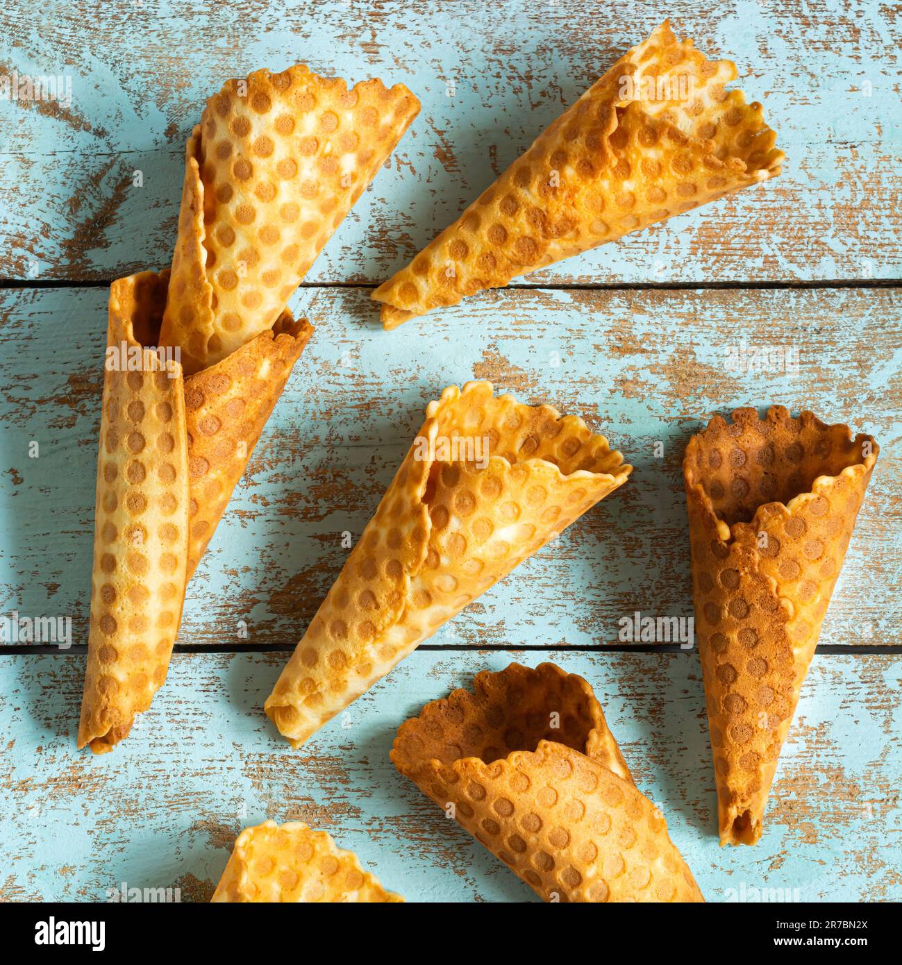 Wafer Cones For Ice Cream On A Blue Background Summer Food Concept wafer-cones-for-ice-cream-on-a-blue-background-summer-food-concept