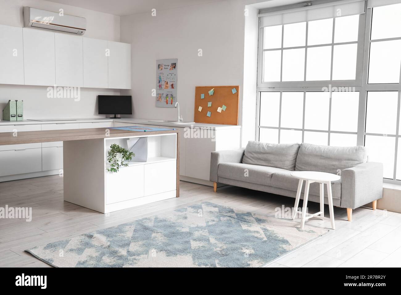 Interior of rehabilitation center with table and sofa Stock Photo - Alamy