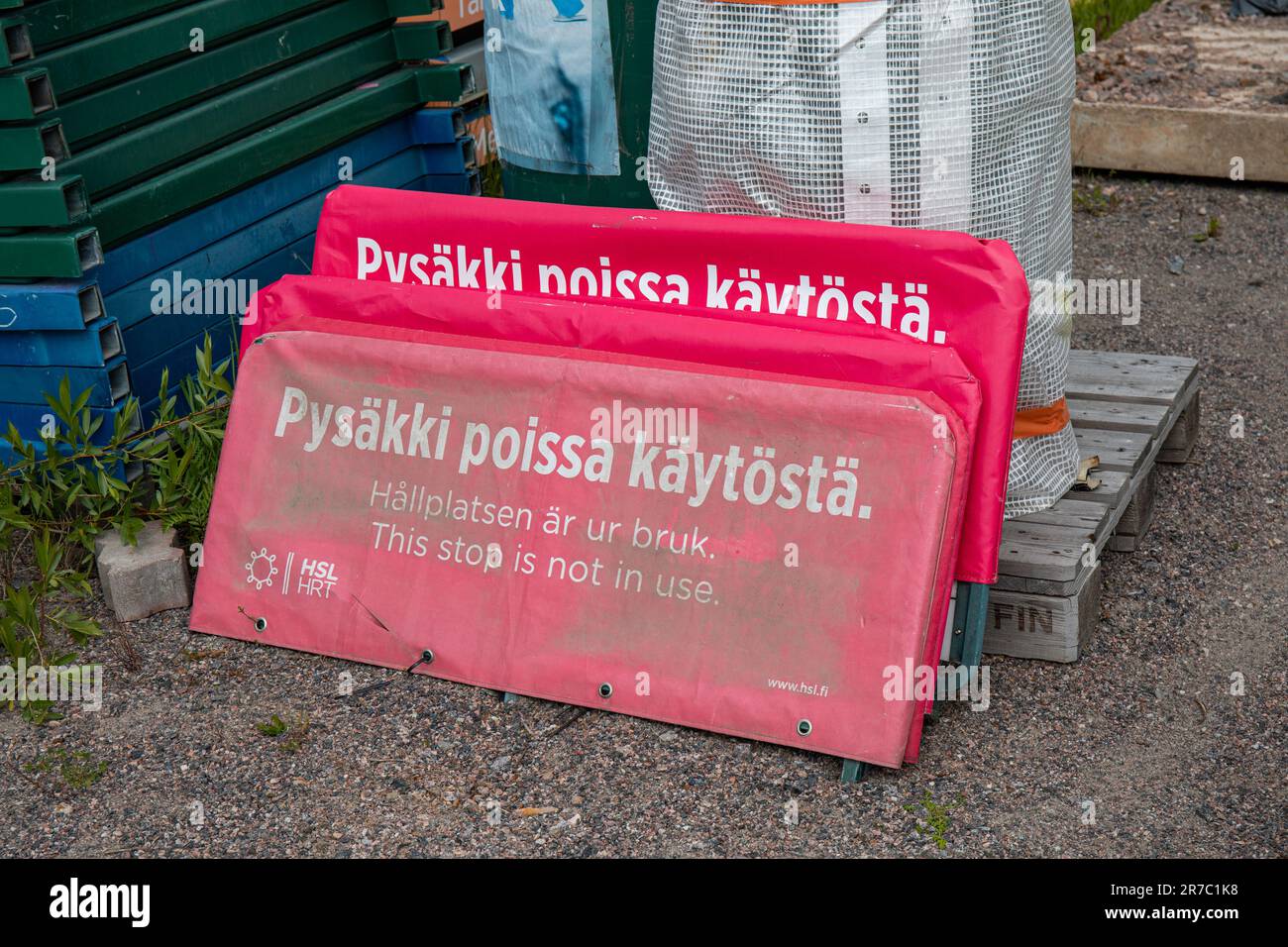 Pysäkki poissa käytöstä. This stop is not in use. Red tram or bus stop sign covers in Kyläsaari district of Helsinki, Finland. Stock Photo