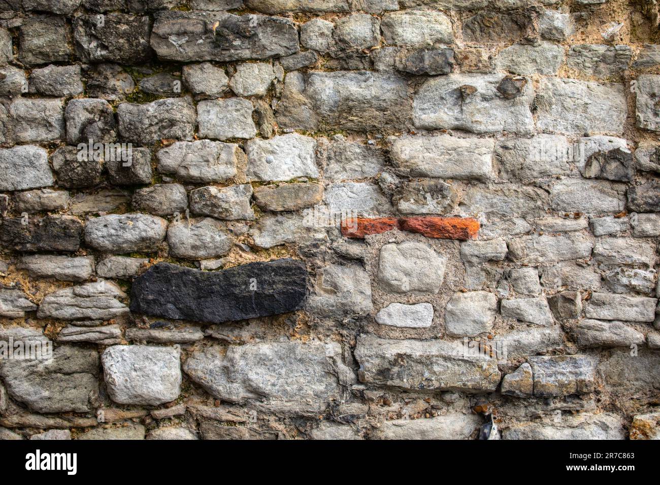 A detail of the remains of London Wall, located near Tower Hill in London, UK.  It was a defensive wall first built by the Romans around what was then Stock Photo