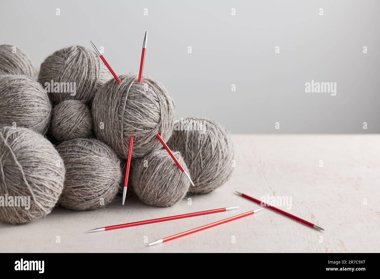 Double pointed knitting needles and balls of yarn Stock Photo