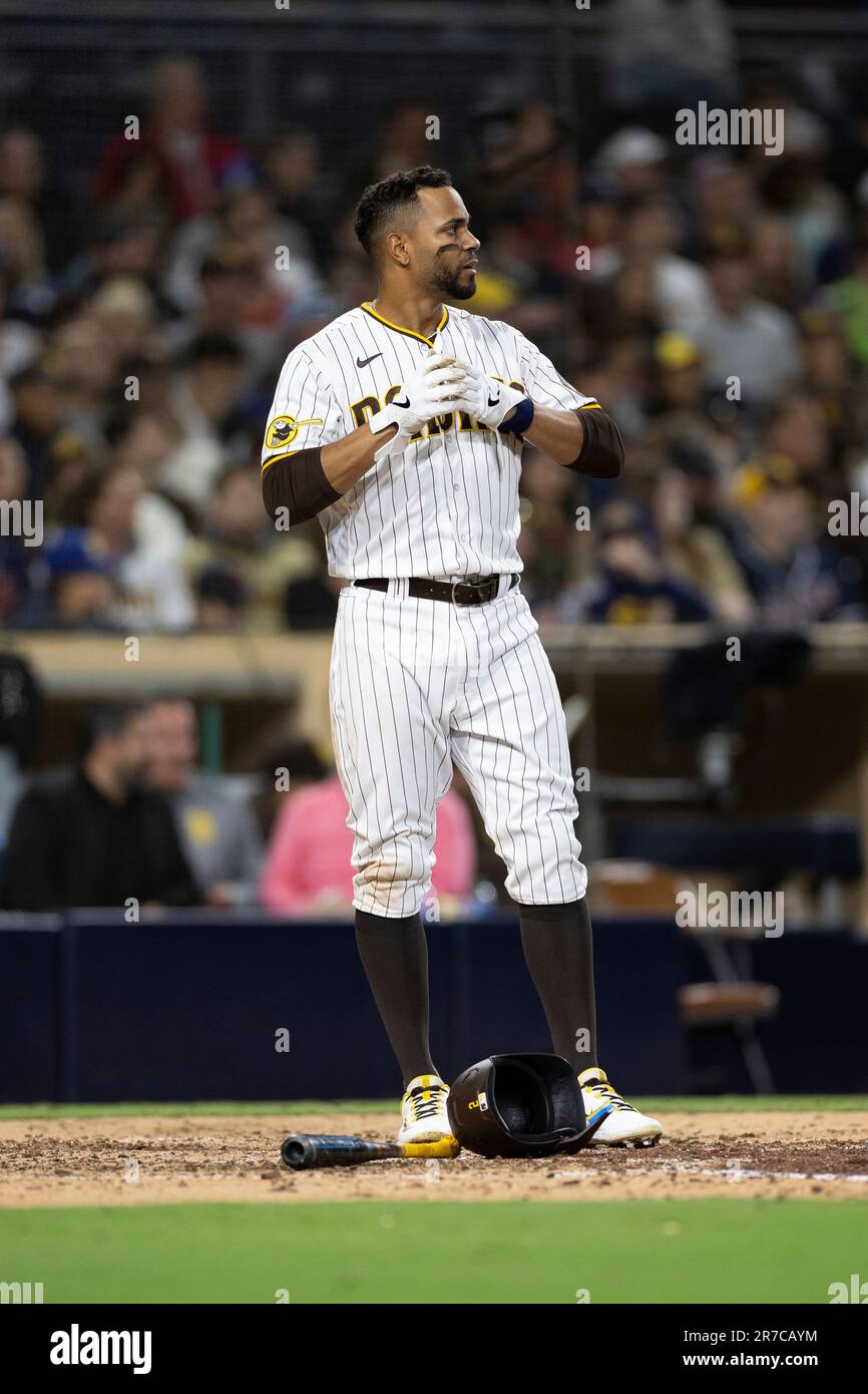 San Diego Padres' Xander Bogaerts takes off his batting gloves after  striking out during at bat against the Cleveland Guardians in a baseball  game Tuesday, June 13, 2023, in San Diego. (AP