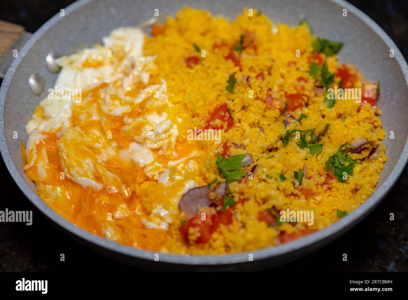 Traditional couscous with egg, typical Brazilian food. Rustic corn