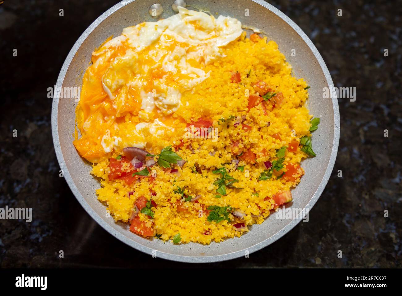 Traditional couscous with egg, typical Brazilian food. Rustic corn