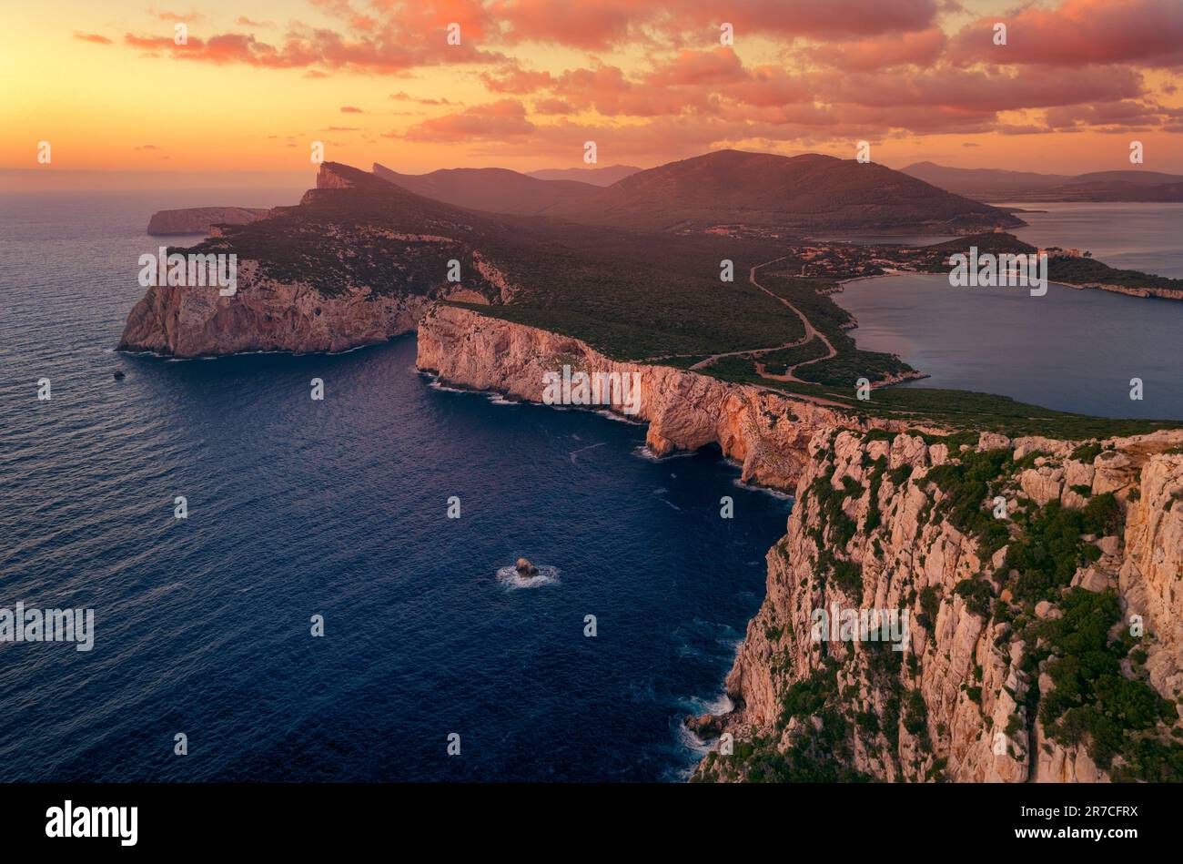 Sardinia sunset ovet Capo Caccia. Alghero Sassari, beautiful sea cliff, rocks and Mediterranean Sea Stock Photo