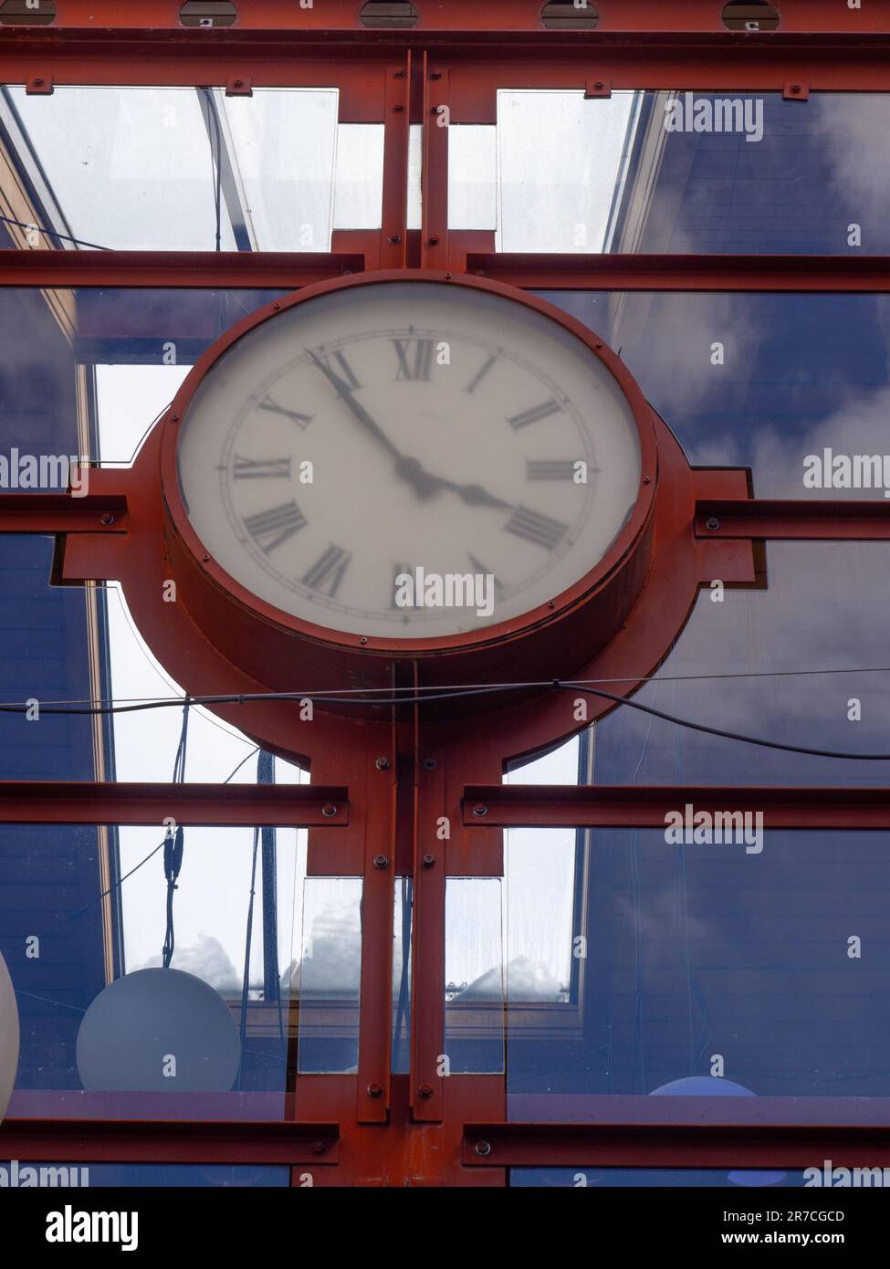 Large Clock In A Rusty Metal Enclosure Stock Photo