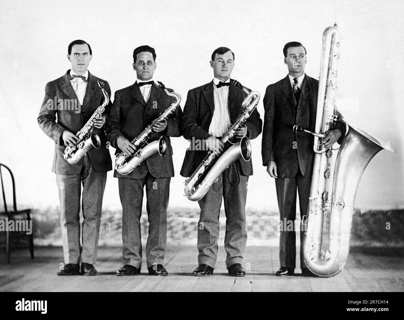 United States, c 1910 Four members of a band all with different sizes