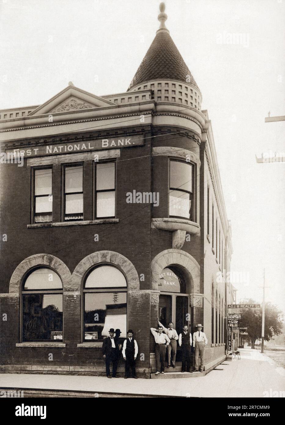 Brookings, South Dakota:  c. 1910 The employees of the First National Bank pose for a portrait in front of the bank. Stock Photo