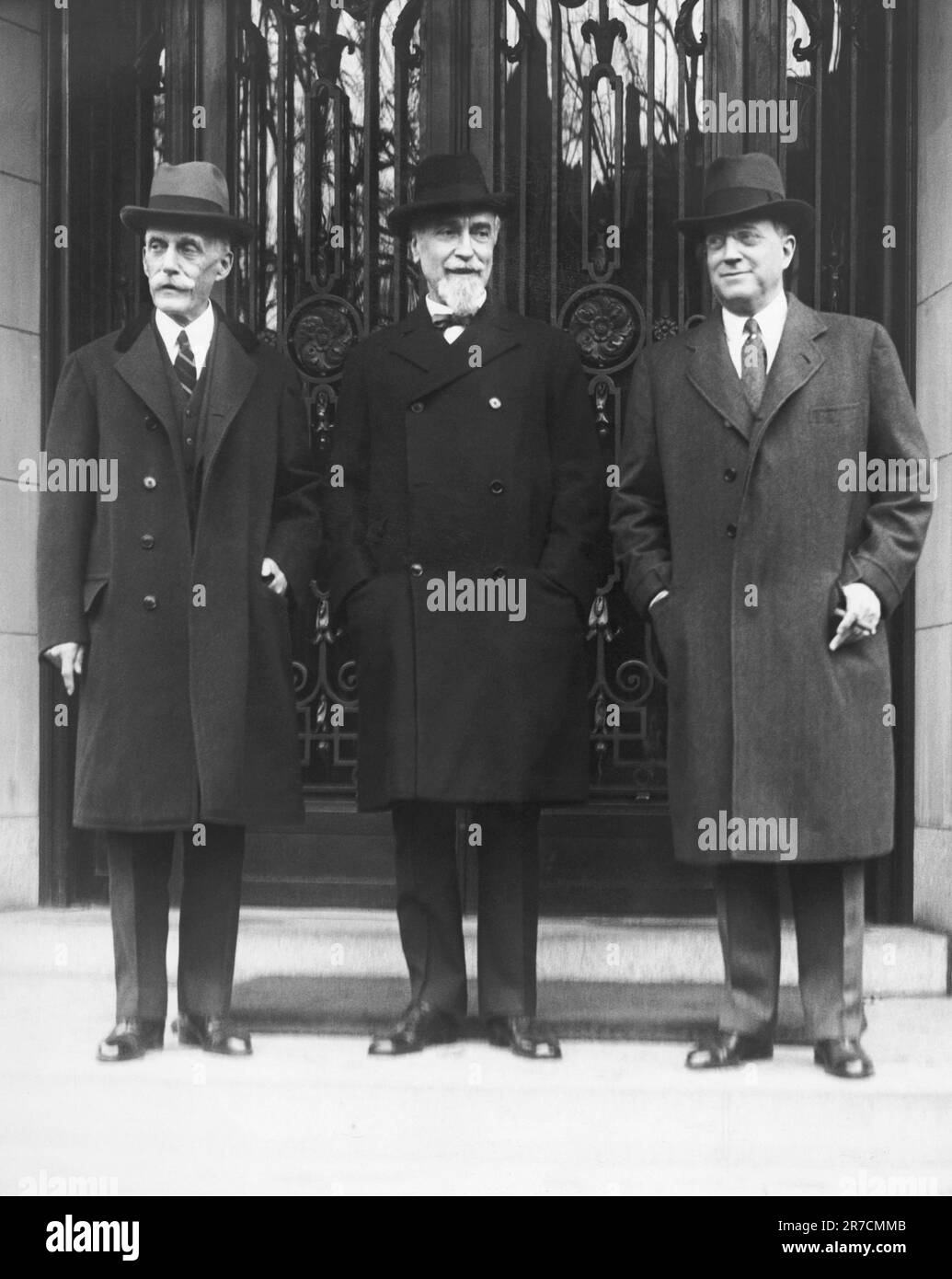 Washington, D.C.:  April 7, 1931 L-R: Treasury Secretary Andrew Mellon, Governor of the Bank of England Sir Montague Norman, and Eugene Meyer, Governor of the Federal Reserve Board, on the steps of Mellon's Washington home before a luncheon. Stock Photo