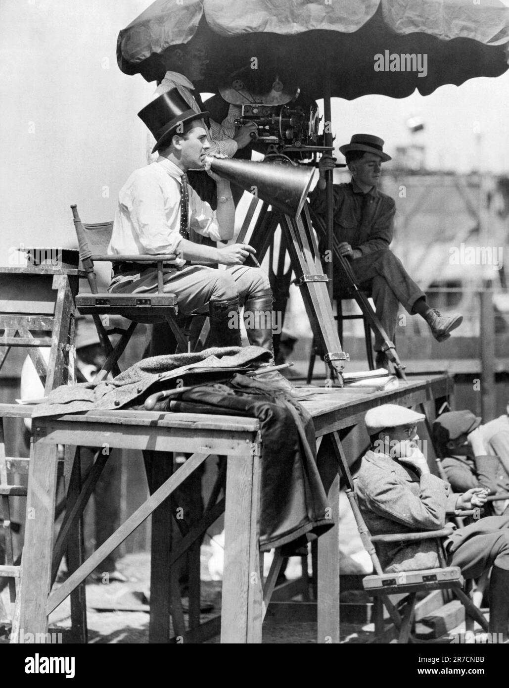 Hollywood, California:   1921   Director Rex Ingram with megaphone, cigar, top hat and knee high boots at work on the set of 'The Four Horsemen of the Apocalypse' starring Rudolph Valentino. Stock Photo