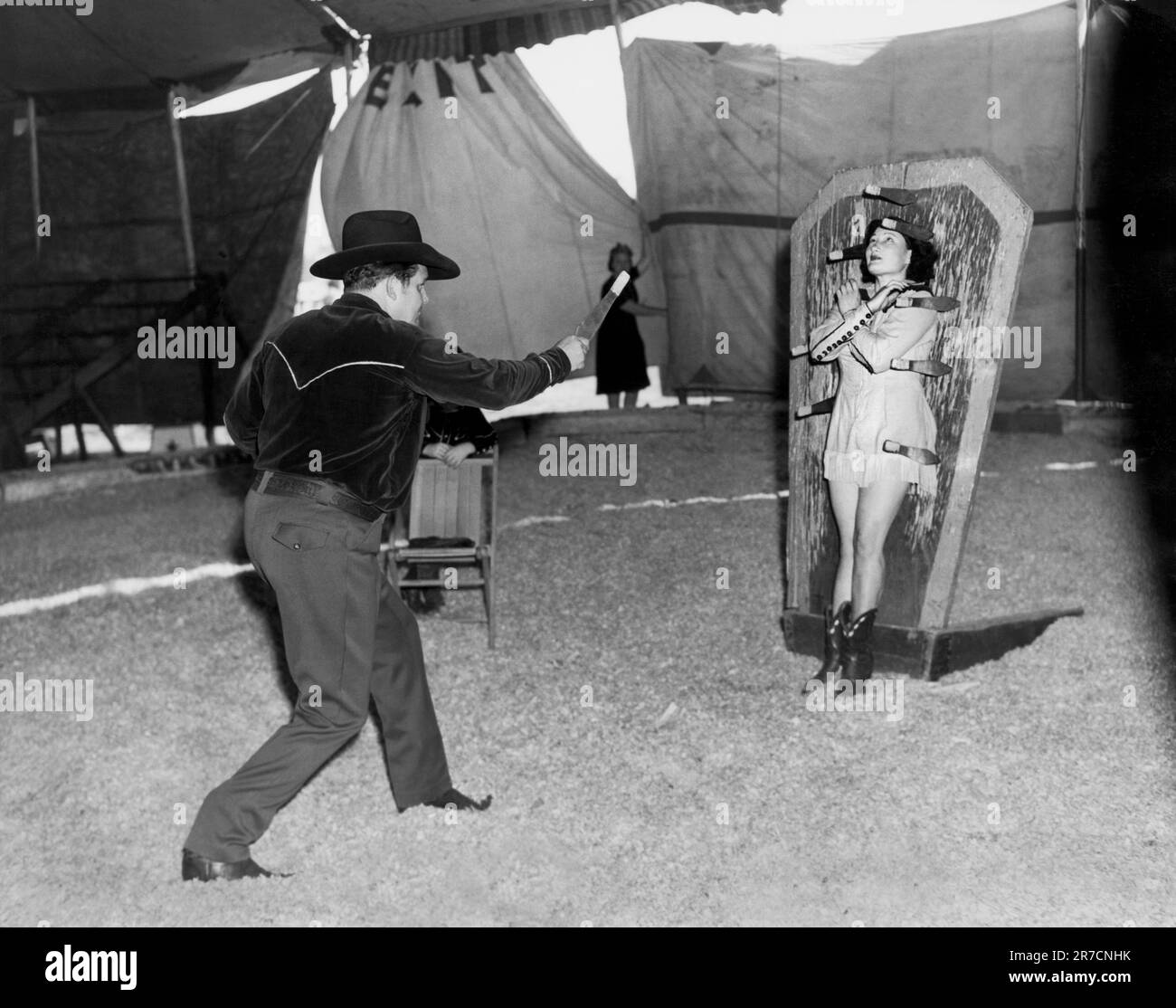 Venice, California:  1945 Tex and Alice Orton practicing their knife throwing exhibition. Stock Photo