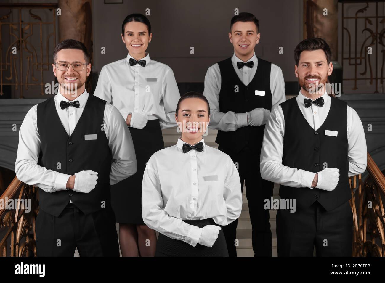 Group of trainees wearing formal clothes in hotel. Professional butler Group of trainees wearing formal clothes in hotel. Professional butler