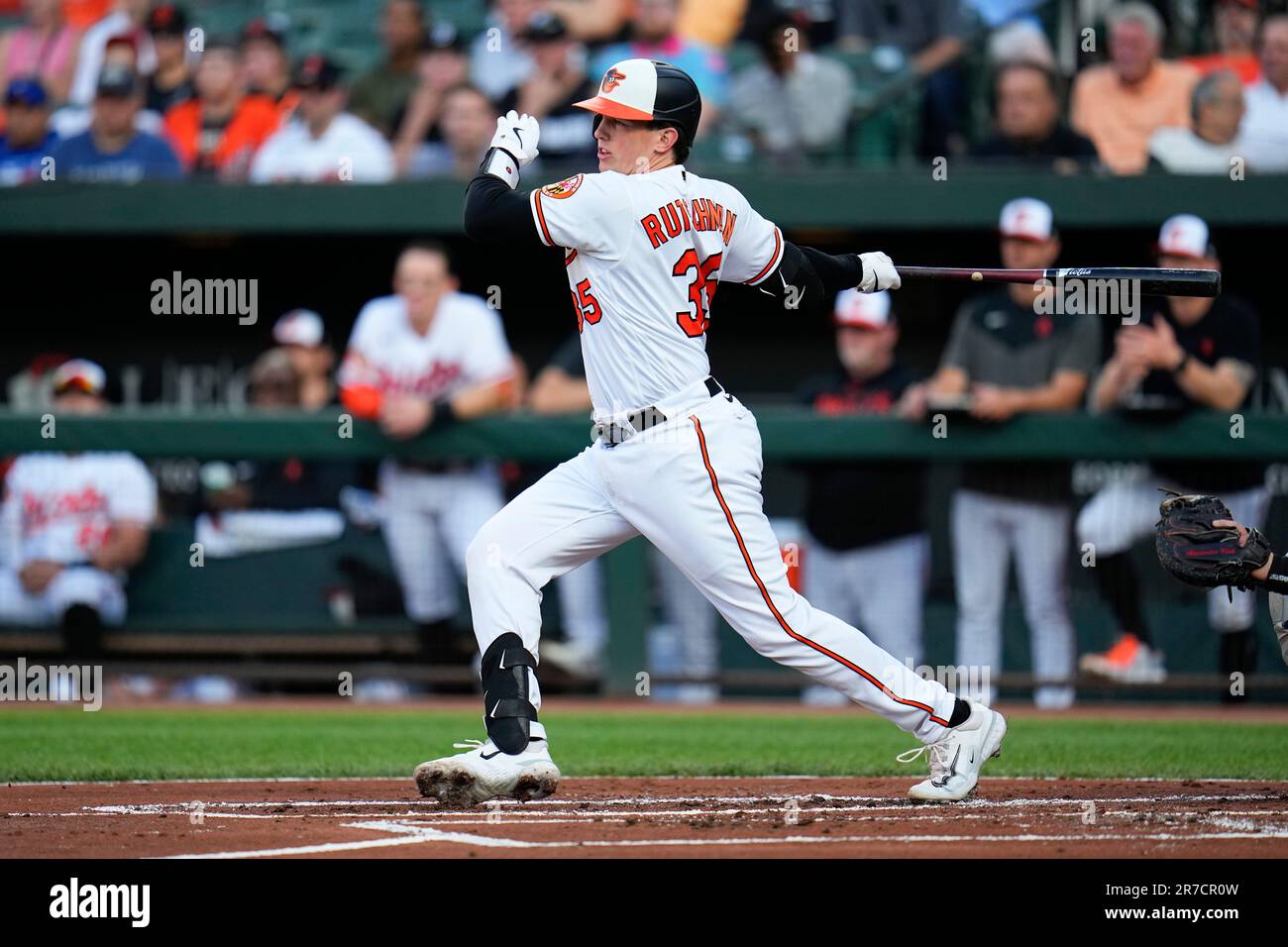 Baltimore Orioles' Adley Rutschman follows through on a swing against the  Toronto Blue Jays during the first inning of a baseball game, Tuesday, June  13, 2023, in Baltimore. (AP Photo/Julio Cortez Stock