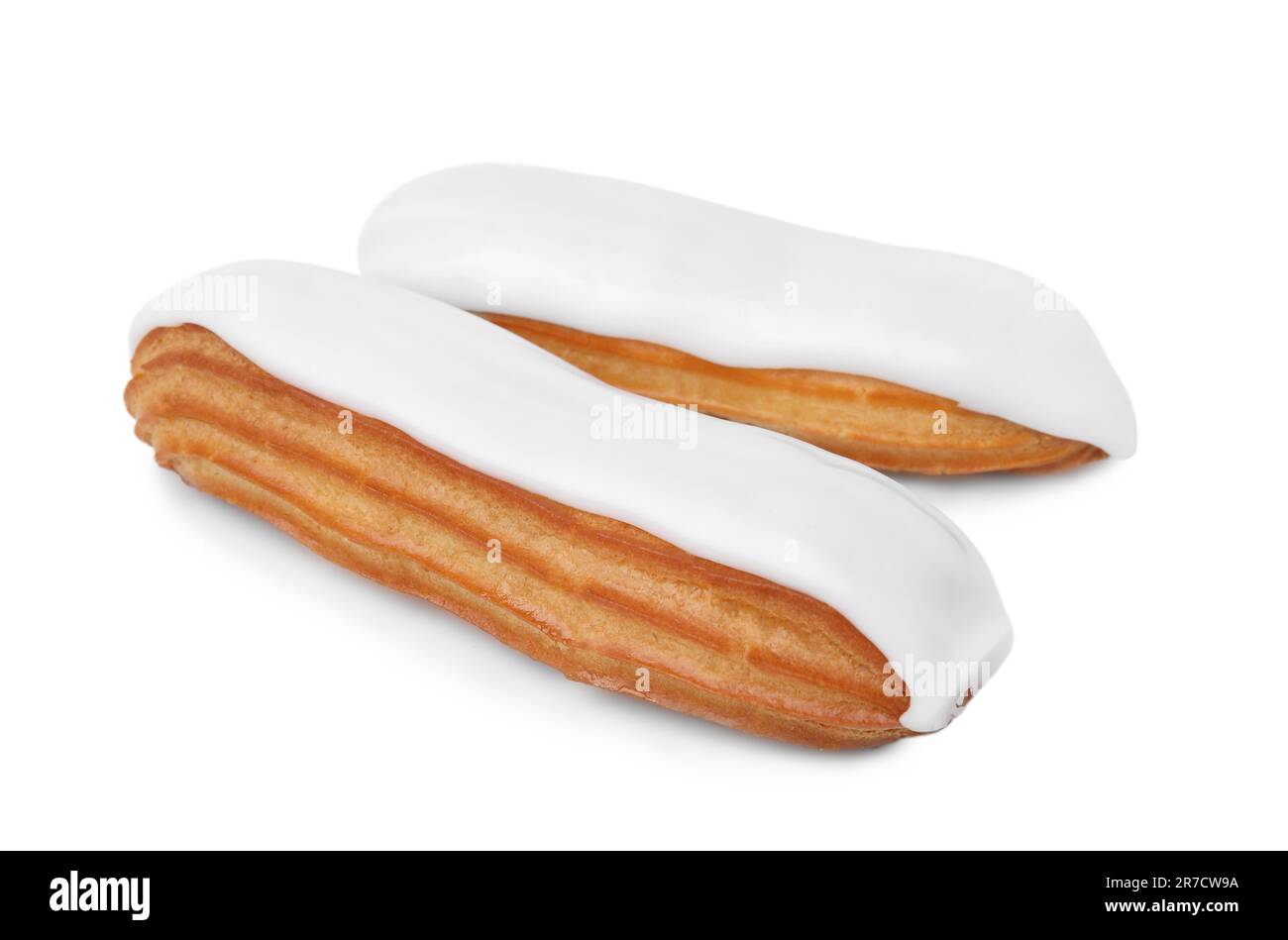 Two delicious eclairs covered with glaze isolated on white Stock Photo