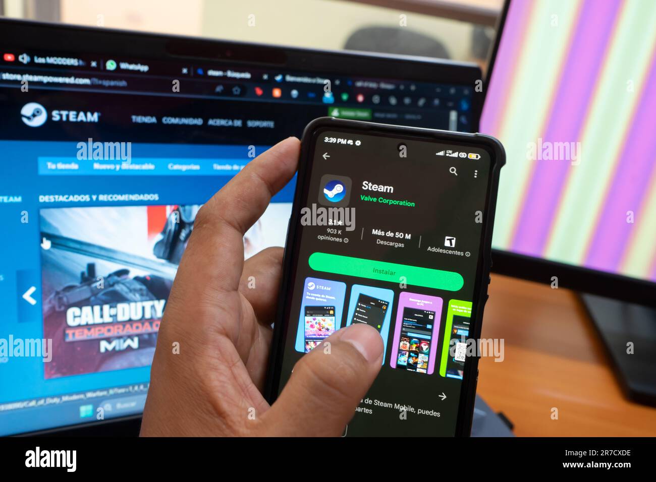 Managua, Nicaragua, June 14th: A Latino man downloads Valve's Steam app