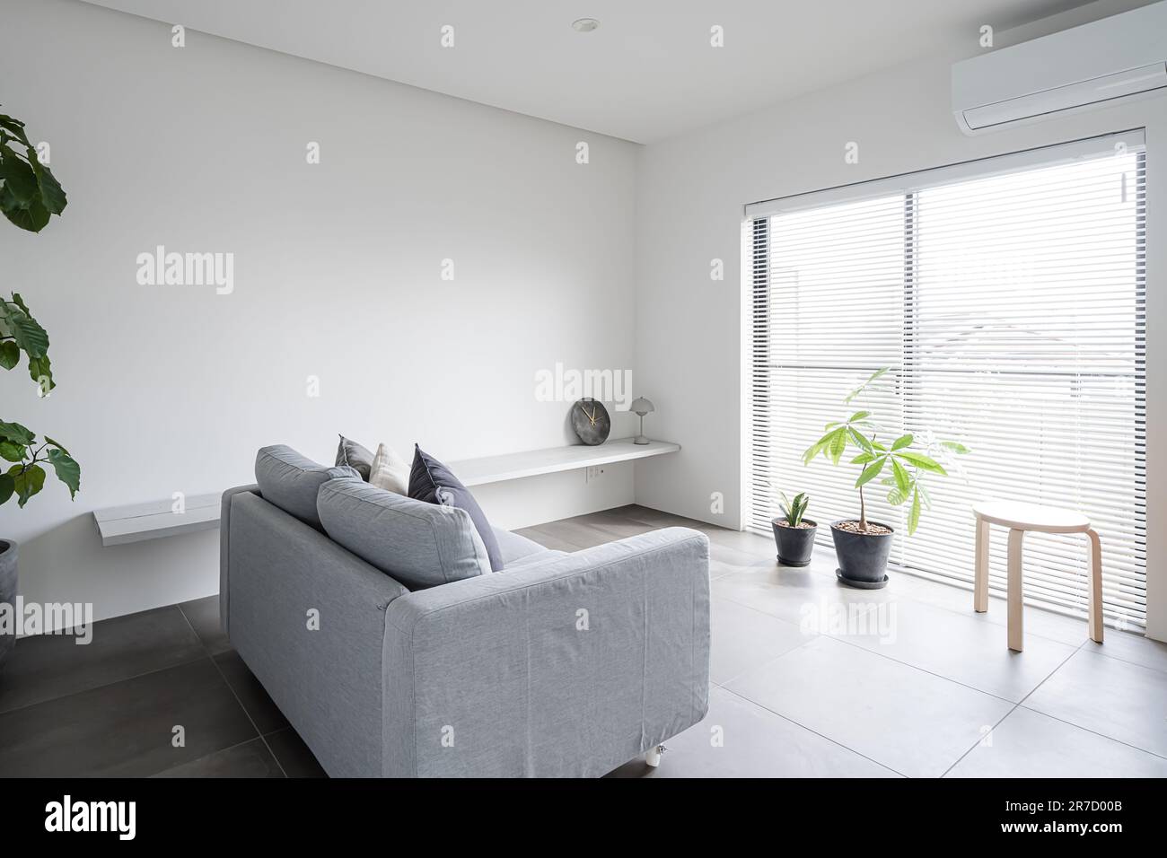 Simple modern style living room with white tone Stock Photo - Alamy