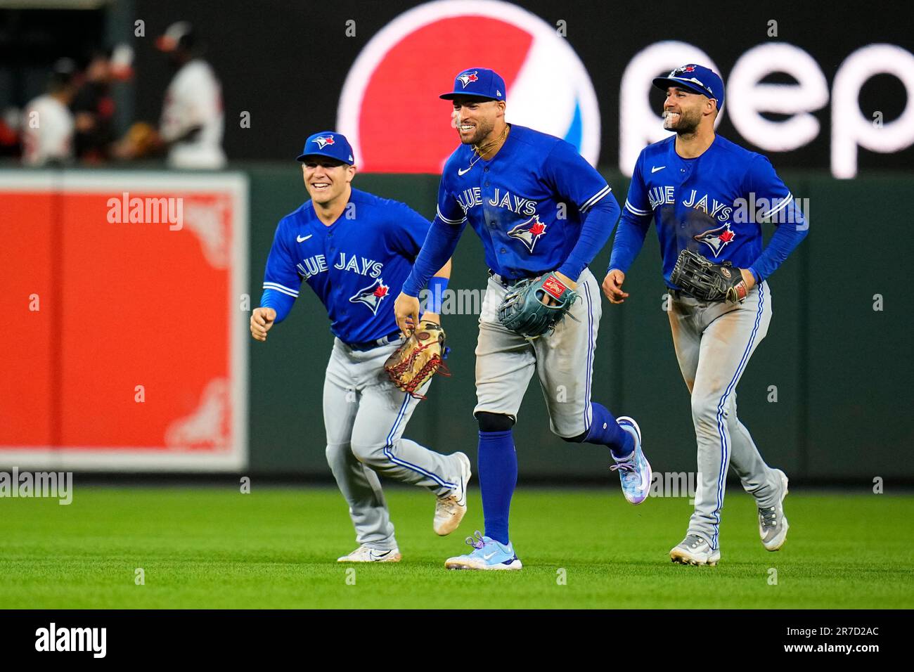 Toronto Blue Jays outfielders Daulton Varsho, left, George Springer,  center, and Kevin Kiermaier react at the end of a baseball game against the  Baltimore Orioles, Wednesday, June 14, 2023, in Baltimore. The