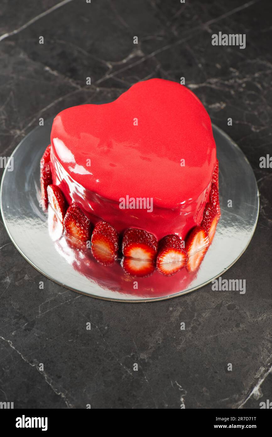 Beautiful heartshaped moist mud cake with a ganache coating, red