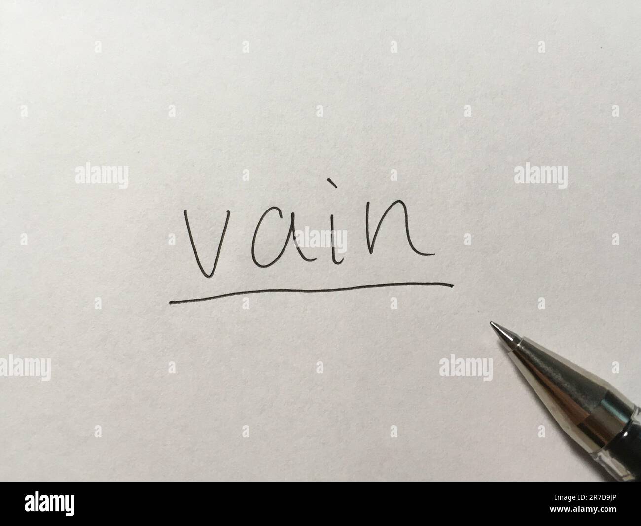 Vain concept word on paper background Stock Photo - Alamy