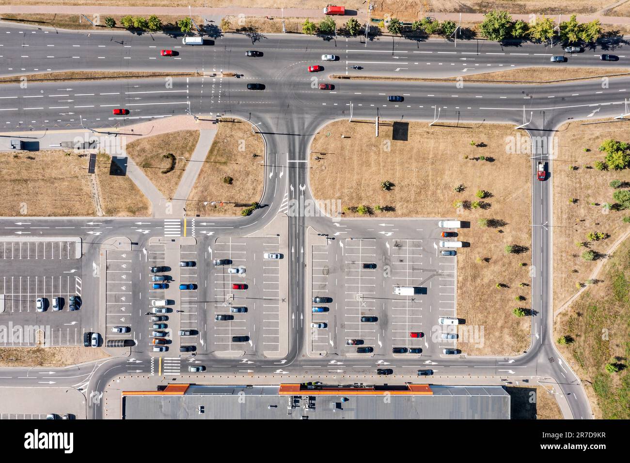 aerial top view of shopping mall parking lot with parked cars. drone photo from above. Stock Photo