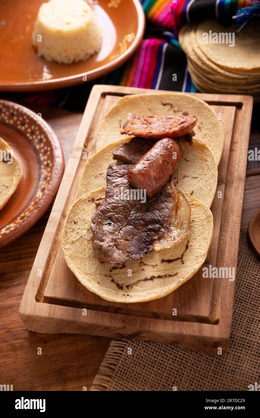 Taco campechano style, Carne Asada. (roast meat) and chorizo or longaniza,  very popular dish in northern Mexico, also called Asado, Discada or Parrill  Stock Photo - Alamy