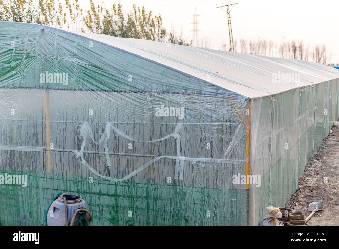 Plastic tunnel greenhouse for plants closeup. Stock Photo