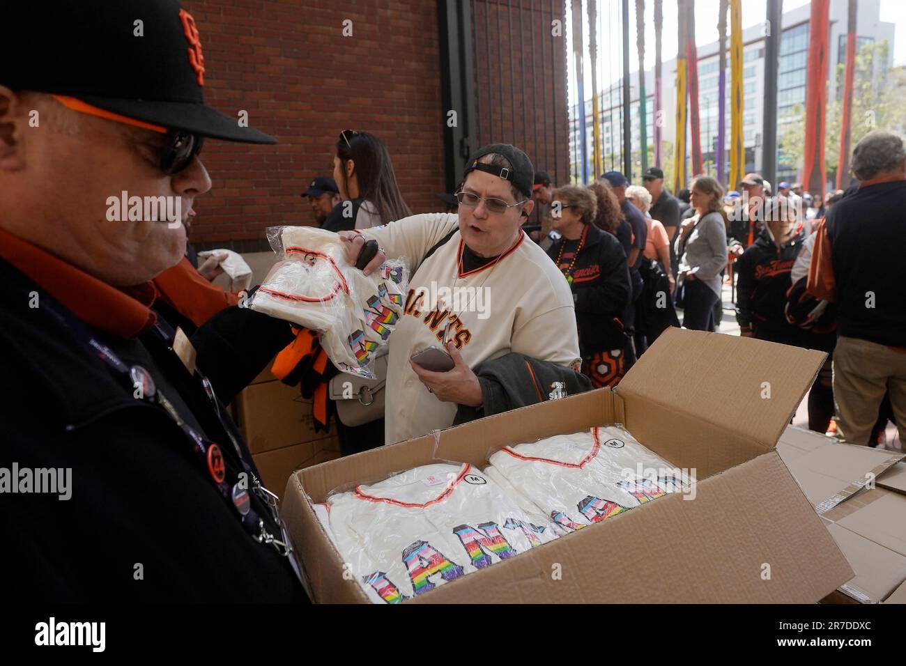 Fans receive San Francisco Giants Pride Jerseys as part of the team's Pride  Day promotional giveaway as they enter Oracle Park before a baseball game  between the Giants and the Chicago Cubs
