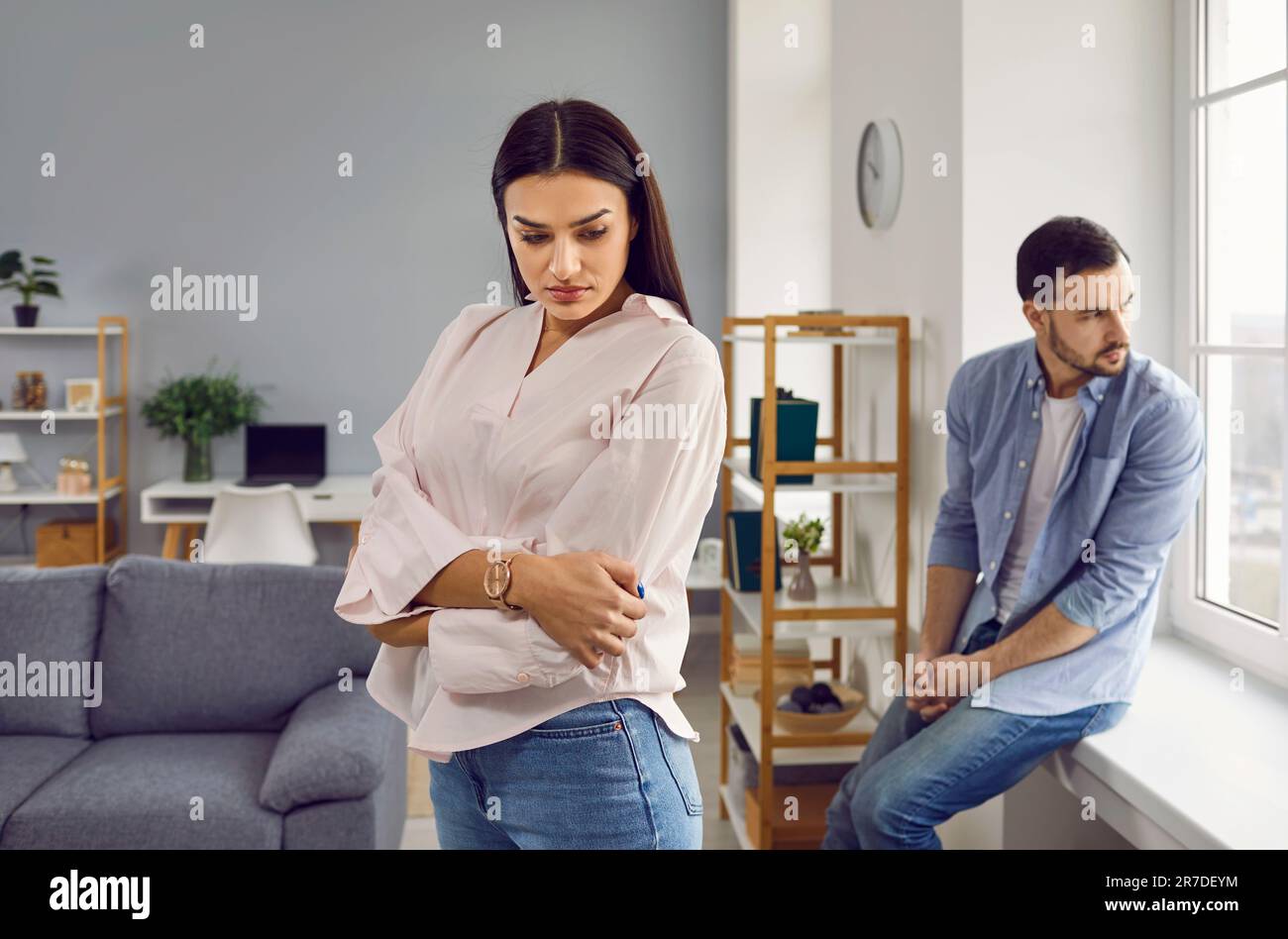 Young family couple experience relationship problems, have a disagreement and quarrel Stock Photo