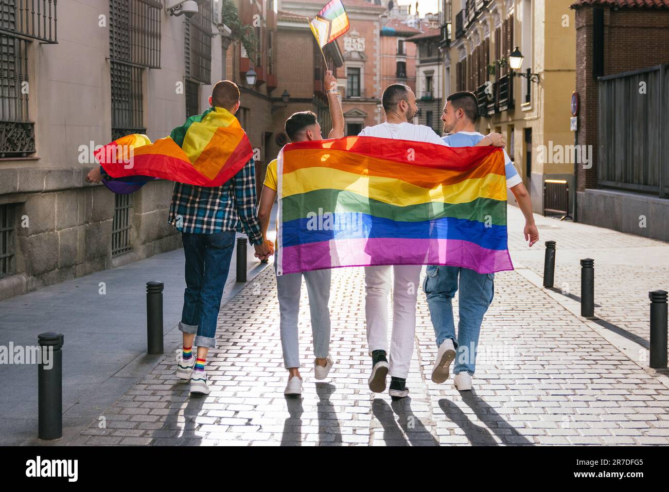 Joyful Gay Friends Embrace, Celebrating LGBTQ Pride in a Sunny City ...
