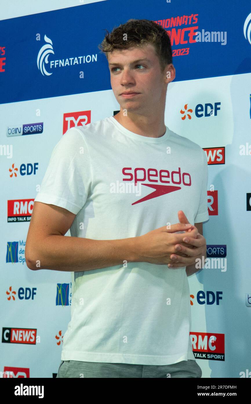Winner Leon Marchand poses during the Swimming French National