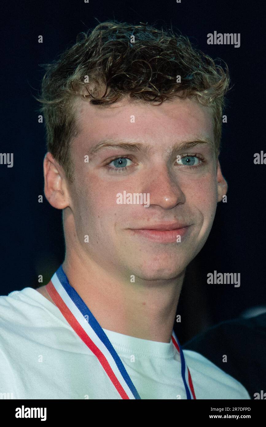 Winner Leon Marchand poses during the Swimming French National