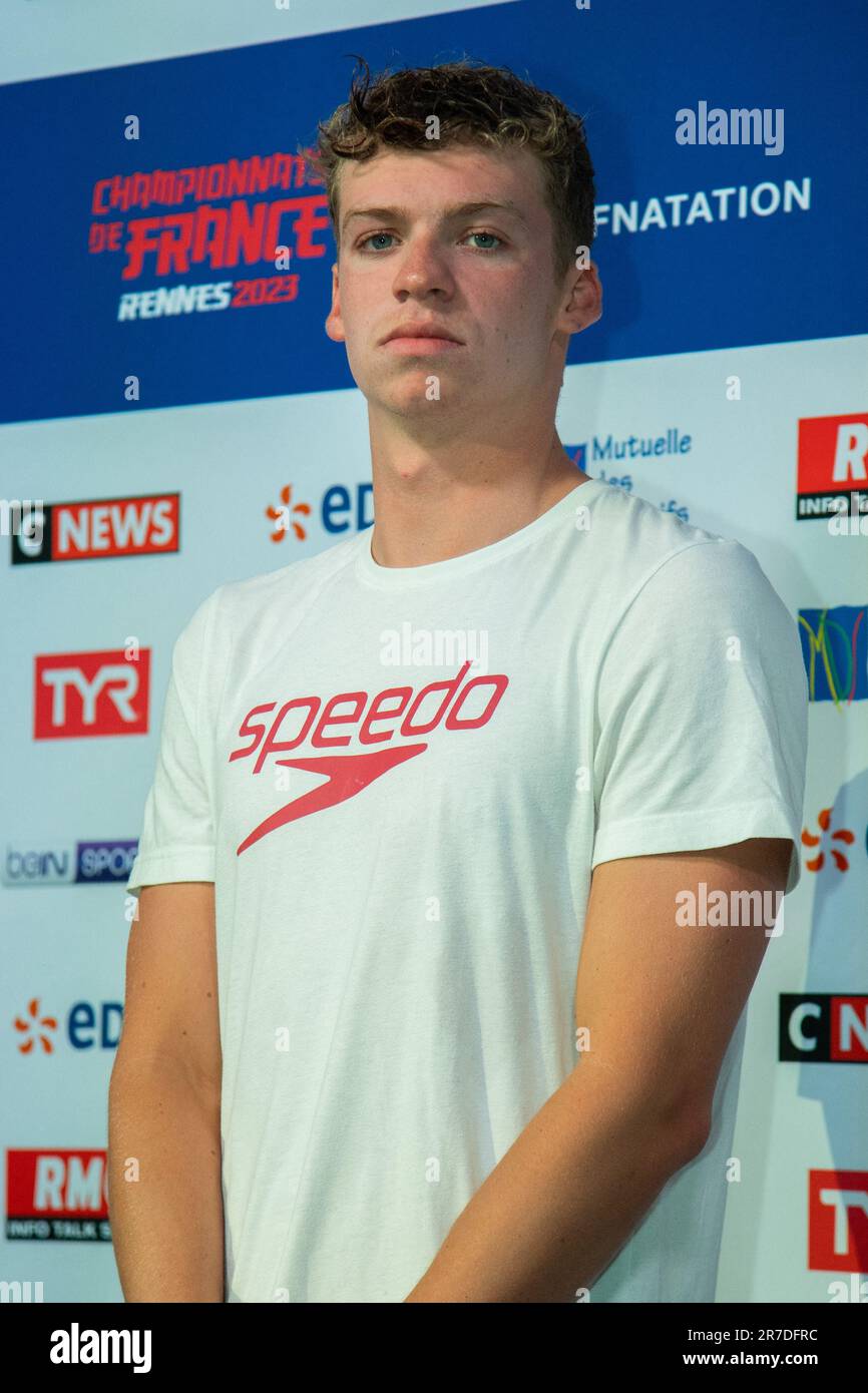 Winner Leon Marchand poses during the Swimming French National