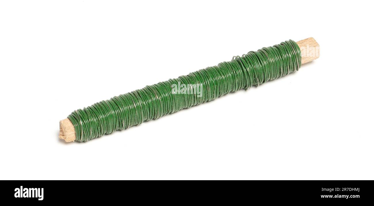 Old steel wire covered with green plastic, isolated on white Stock