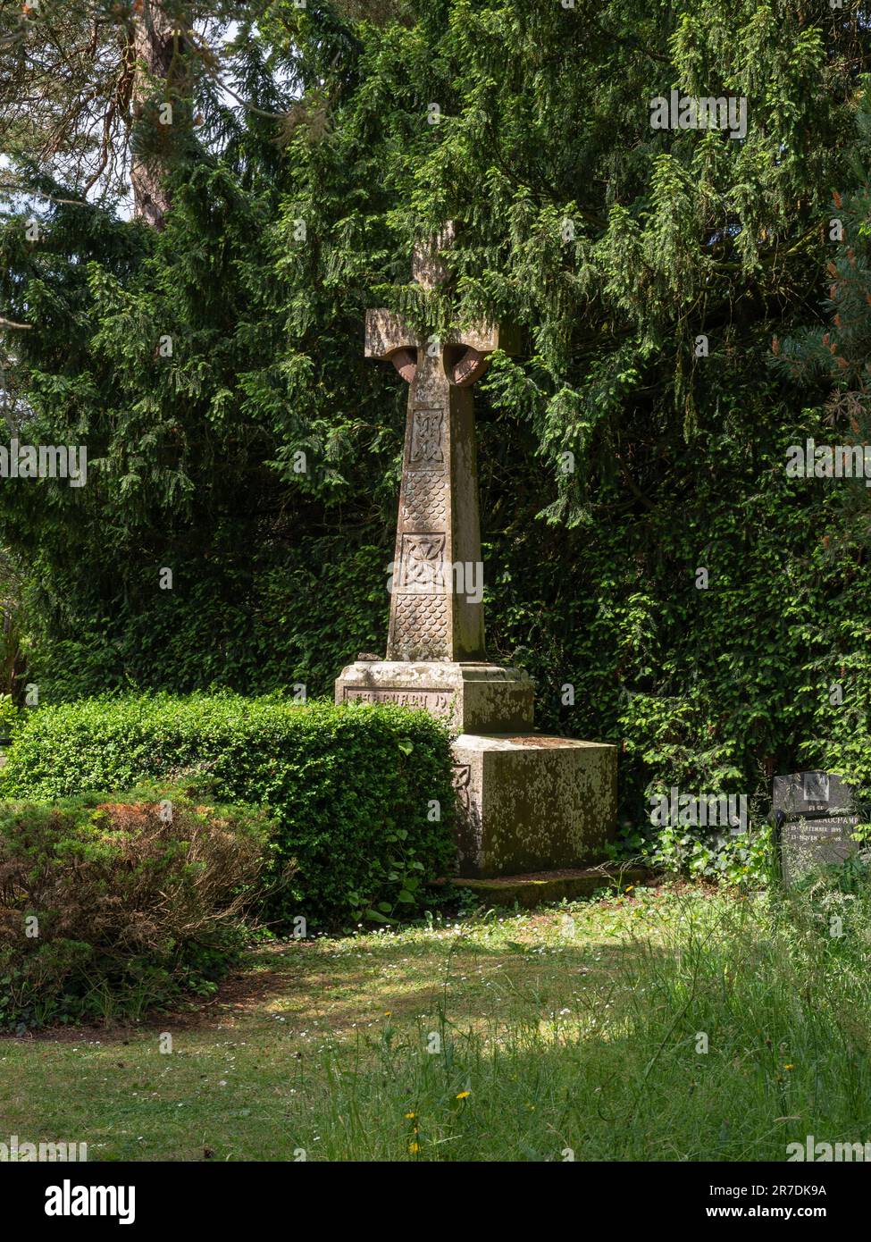 Stone cross in the grounds of Madresfield Court, Malvern, Worcestershire, UK; marks the site of a church subsequently rebuilt in the nearby village Stock Photo