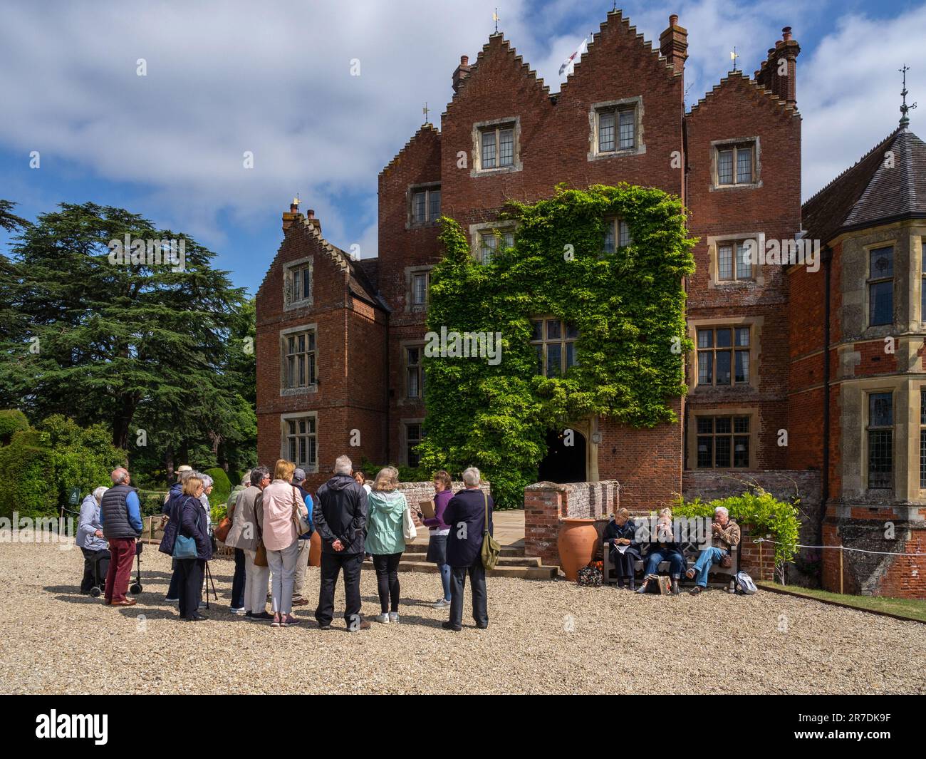 Senior tour group, Madresfield Court, a Tudor moated country house with Victorian additions, Malvern, Worcestershire, UK Stock Photo