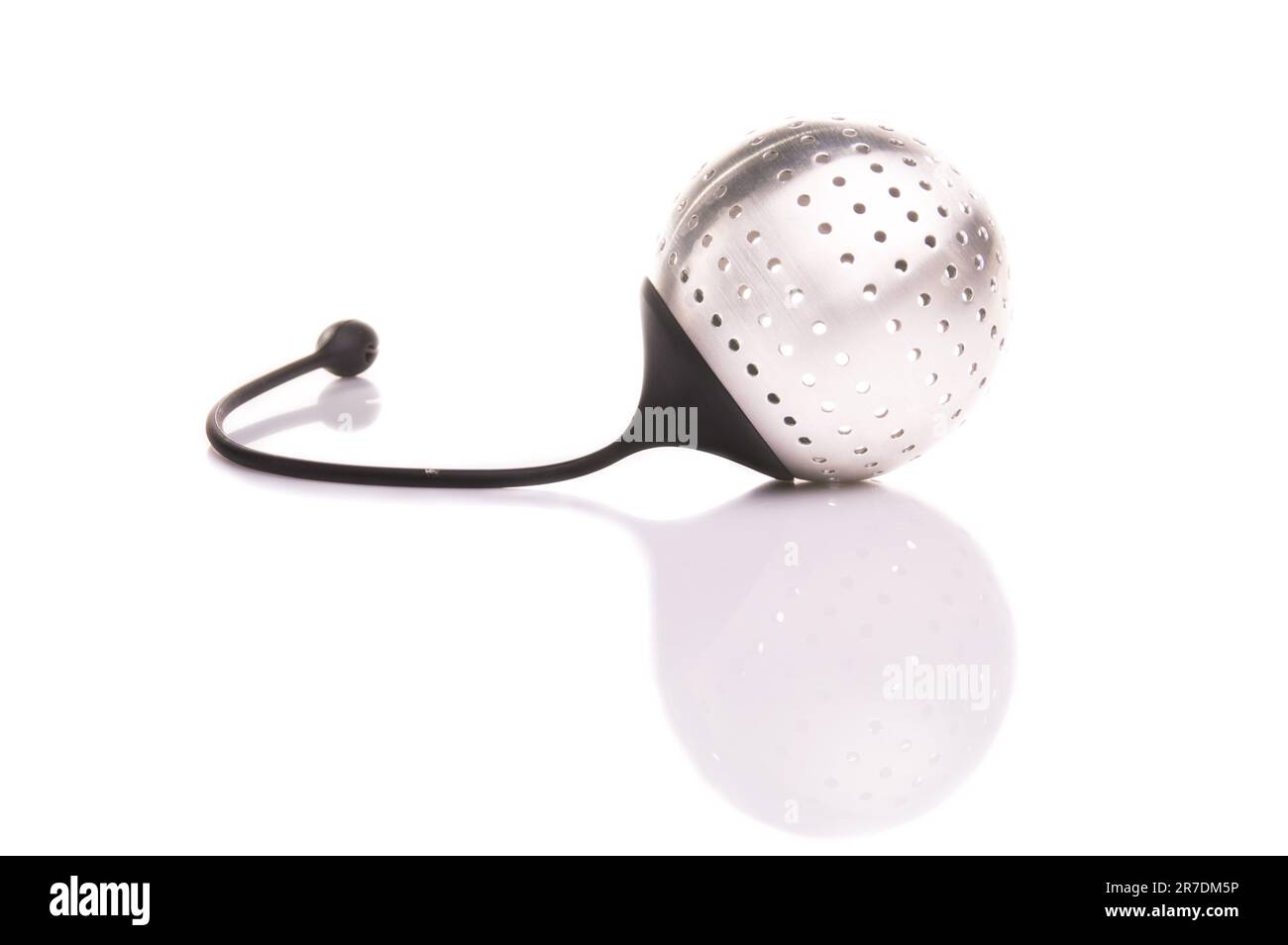 A stainlesssteel ballshaped tea strainer with a removable lid