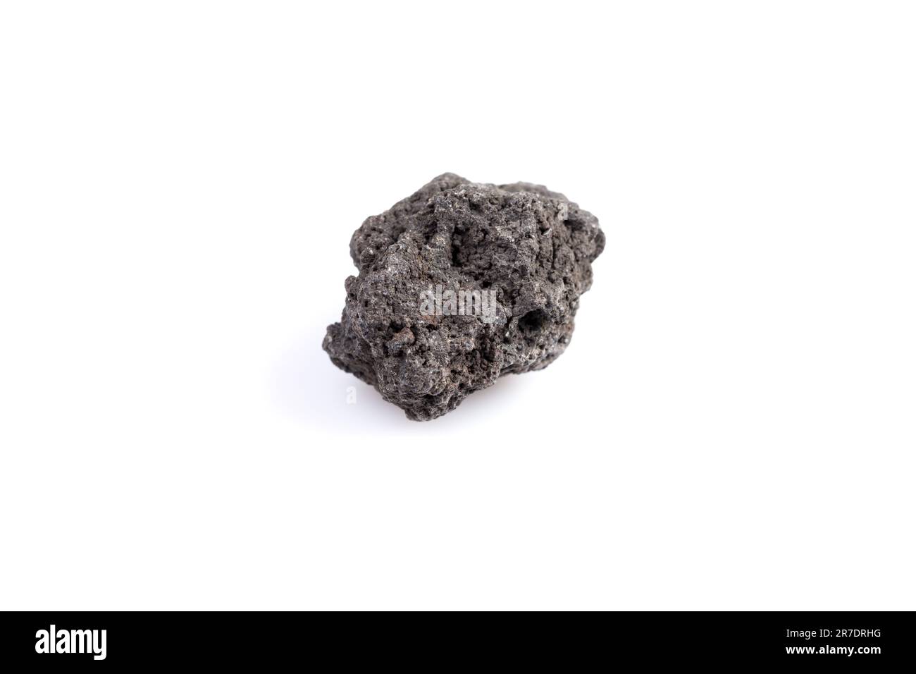 Black lava rock from volcano on a white background Stock Photo - Alamy