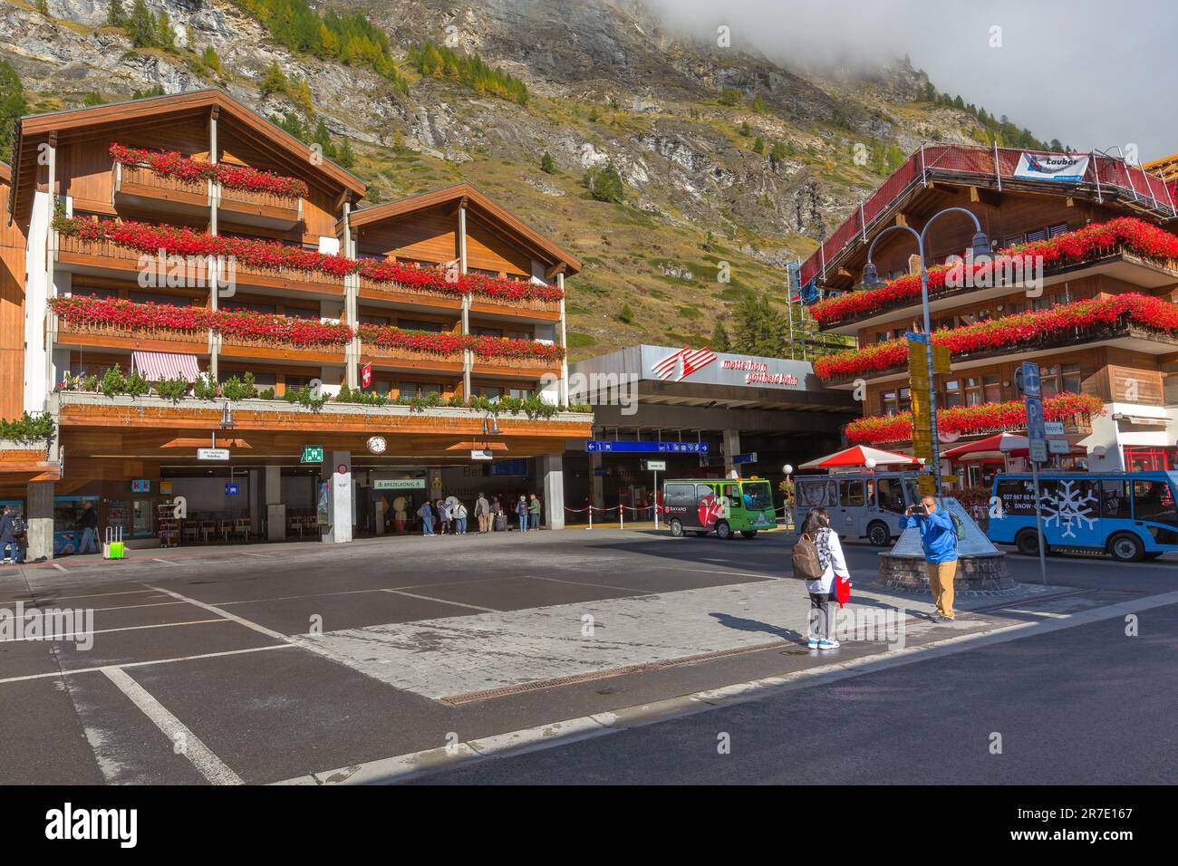 Zermatt, Switzerland - October 7, 2019: Town center street and railway ...