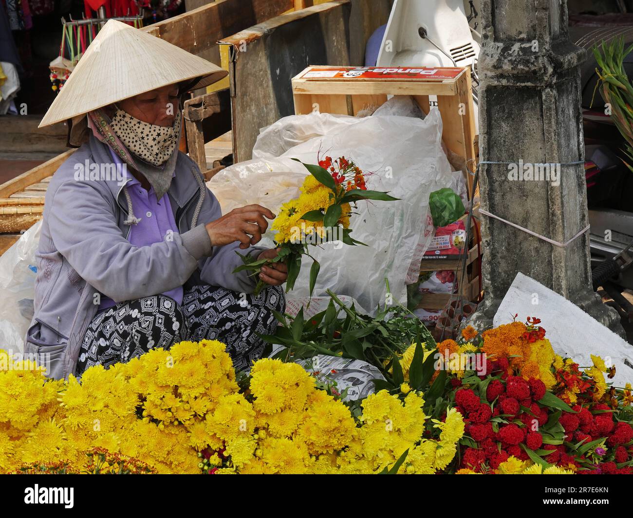 Vietnam, Quang Nam Province, Hoi An City, Old City listed at World Heritage site by Unesco, the Market, Woman selling Flowers Stock Photo