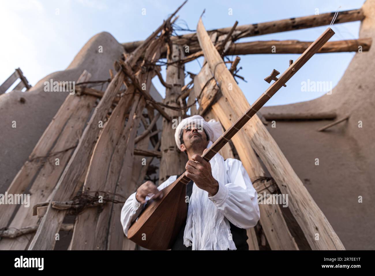 A couple play traditional music instrument and play the folkur dance in ...