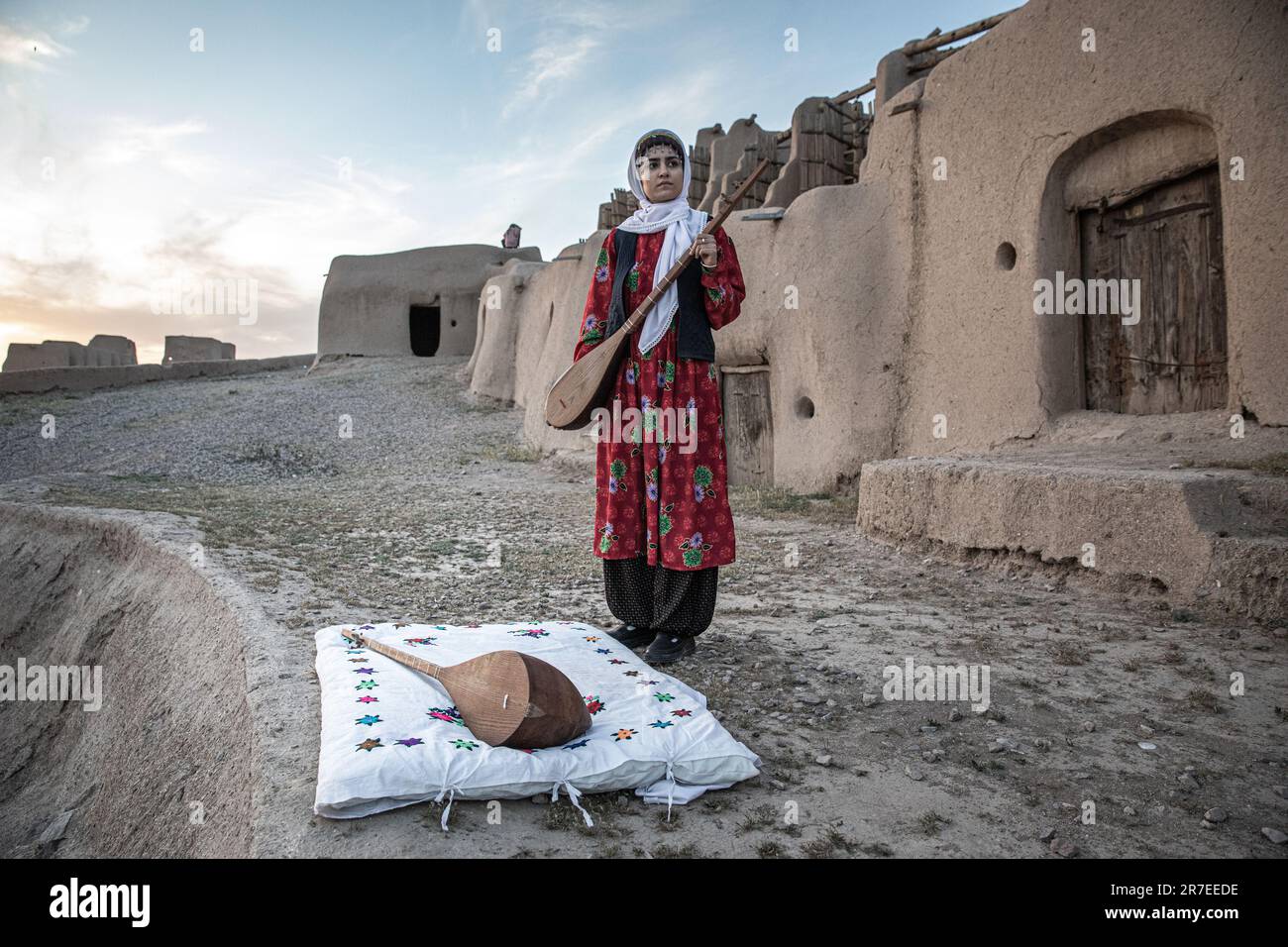 A couple play traditional music instrument and play the folkur dance in KHaf, KHORASAN. IRAN. Stock Photo