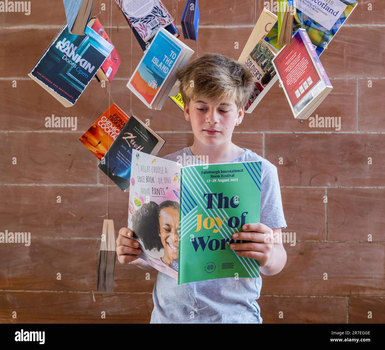 A 12 year old boy reads the Edinburgh International Book Festival 2023