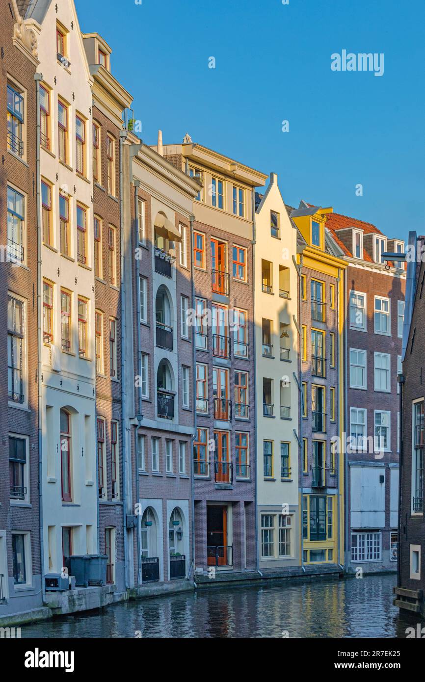 Residential Houses at Water Canal in Amsterdam City Centre Stock Photo