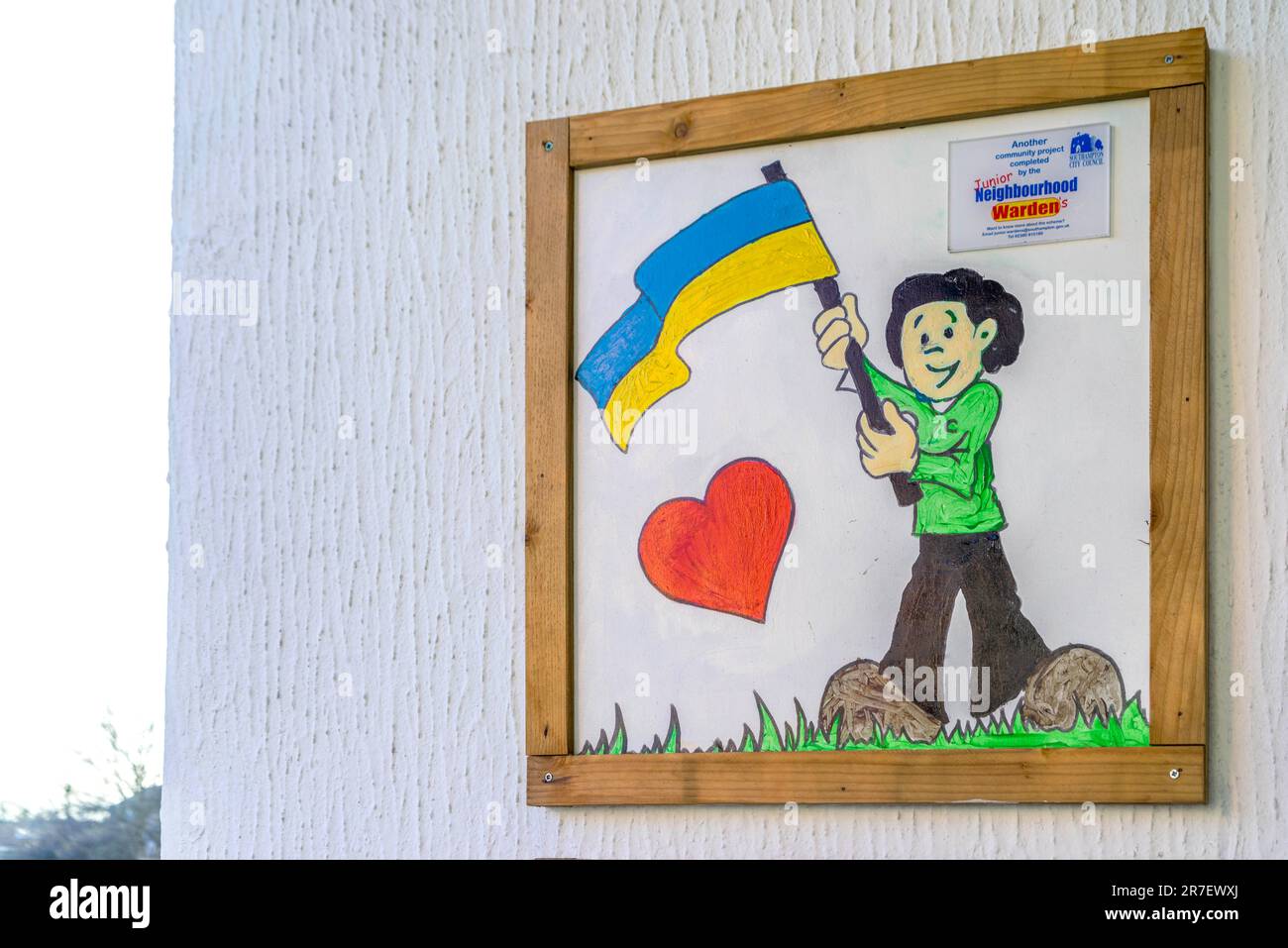 A drawn picture of a young boy waving the Ukrainian flag, part of a Neighbourhood Warden project in Southampton, England, UK Stock Photo